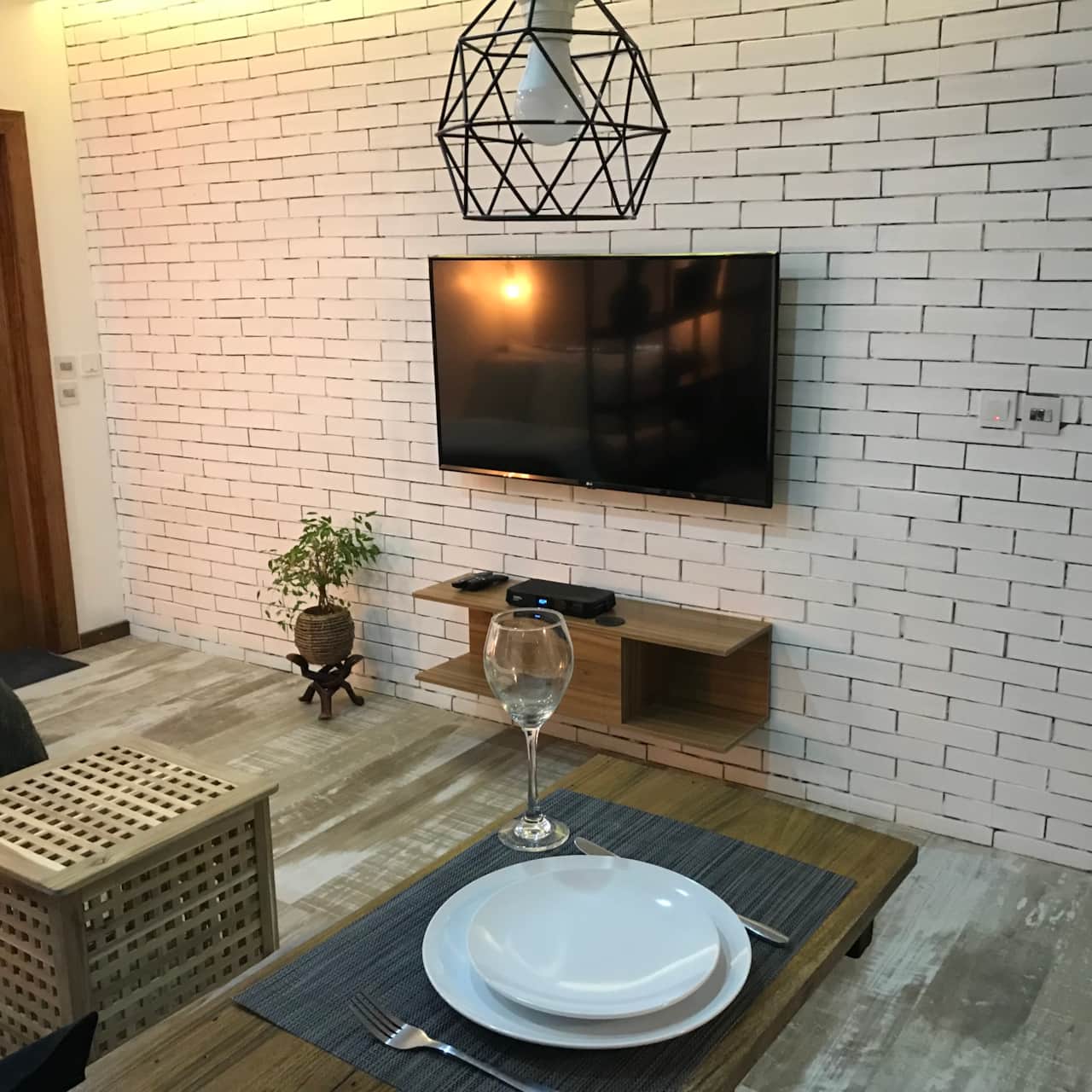 2-seater corner sofa with 55-inch smart tv