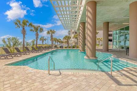 Oceanfront sundeck featuring a 60' pool, 2 hot tubs and kiddie pool!