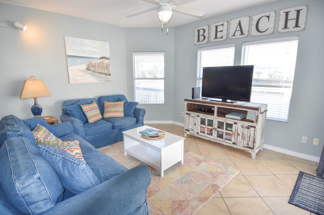 Living area with fold-out sofa. All TVs have Amazon Firesticks & Netflix!