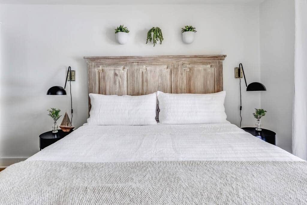 Master bedroom with king bed, private bathroom, TV, and private balcony. 