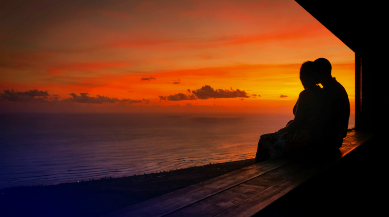 Couple watching the sunset in Kona