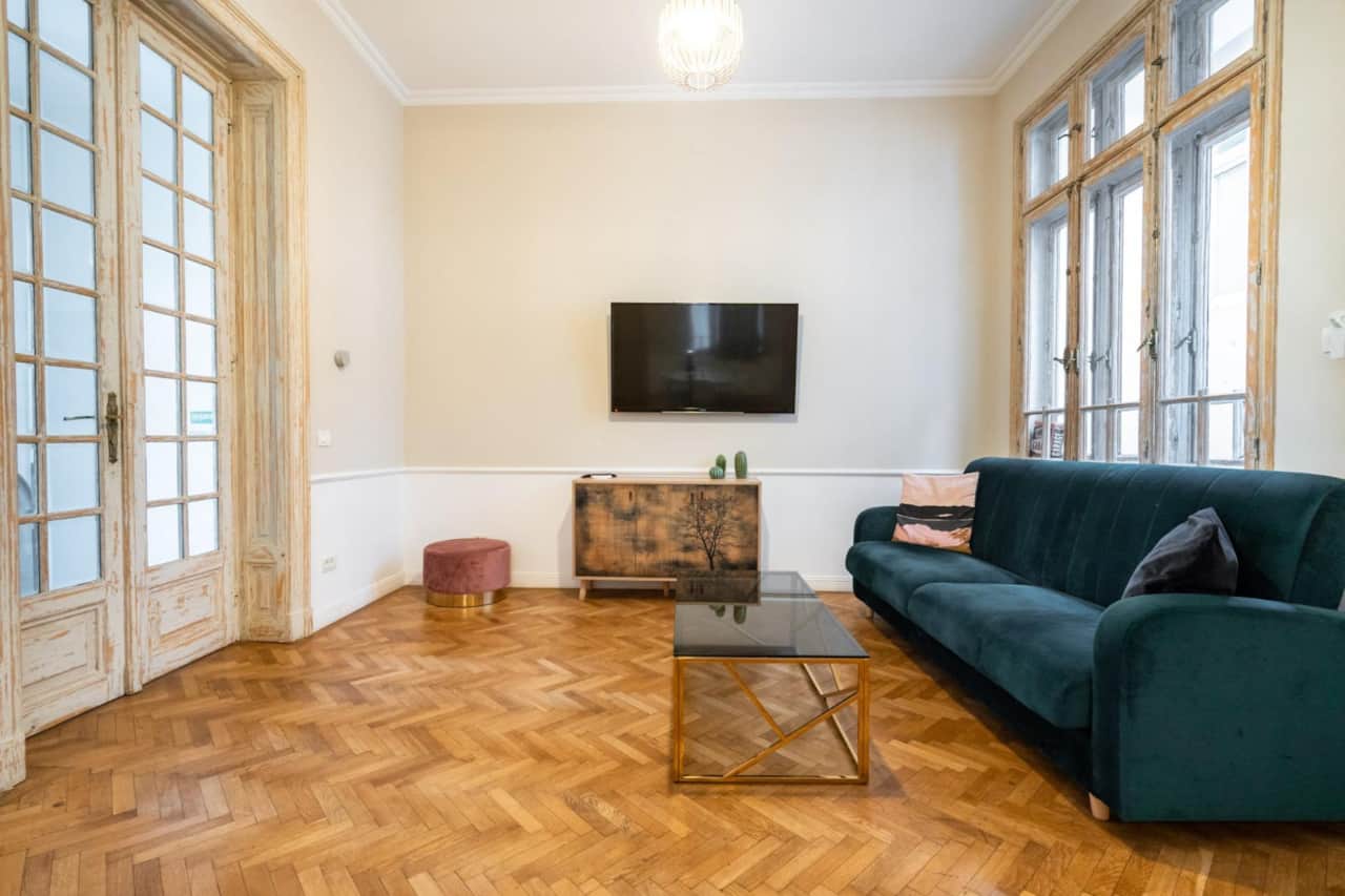 Bright lounge space with seating area in 3-bedroom apartment in Bucharest