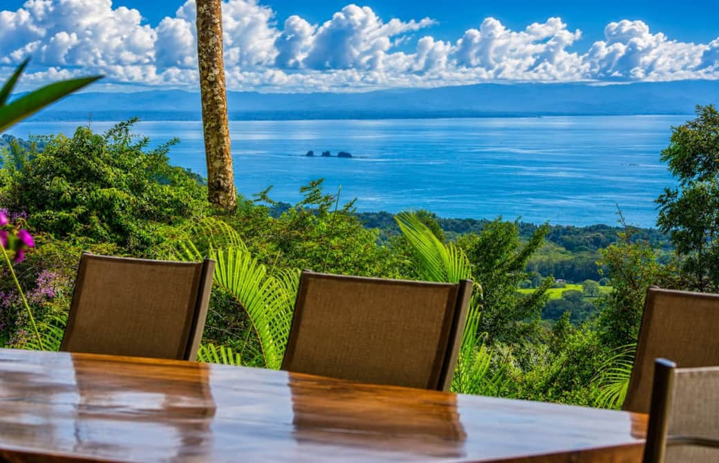 Dine with one of Costa Rica’s most breathtaking backdrops. The handcrafted live-edge table overlooks the Pacific Ocean, lush rainforest, and the famous Whale’s Tail, creating an unforgettable setting for every meal