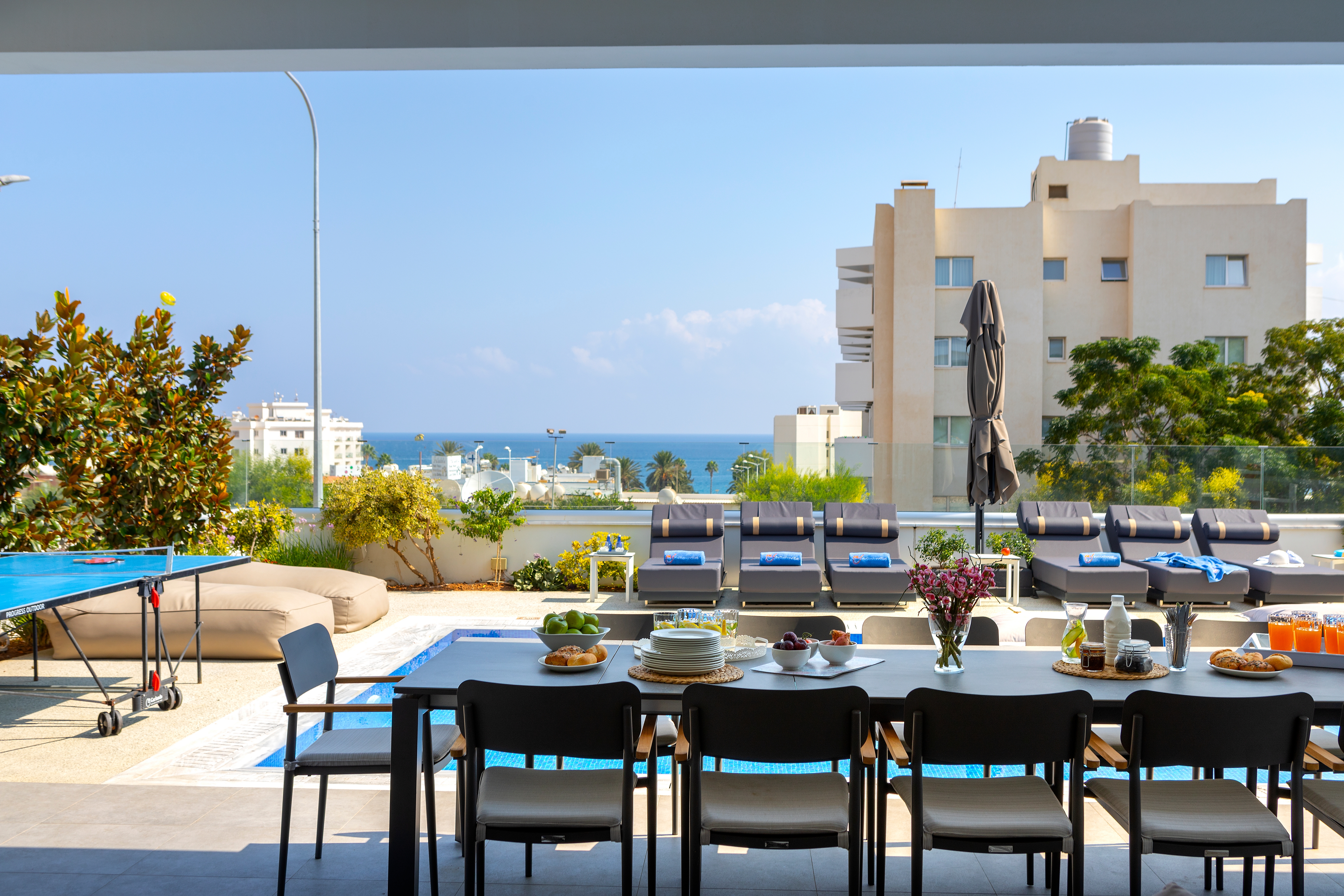 Fig Tree Bay Residences outdoor dining area with a sea view