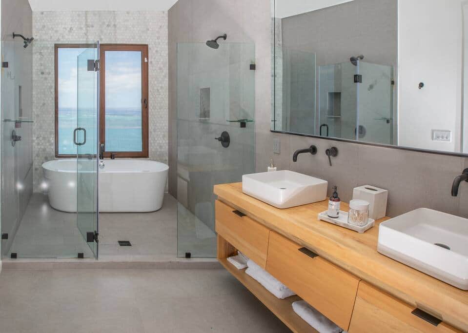 Upper level 1st suite, bathroom with dual shower heads, sinks and a soaking tub