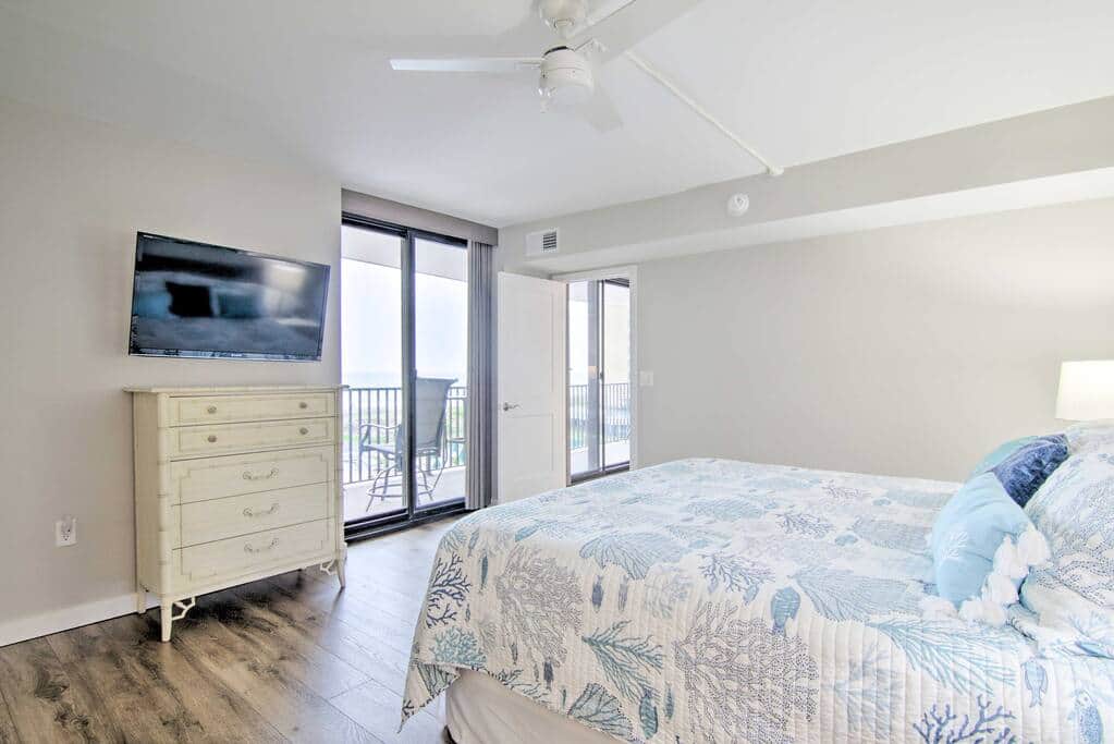 Enjoy a morning read in bed in the Primary Bedroom while watching the sun come up and tide roll in.