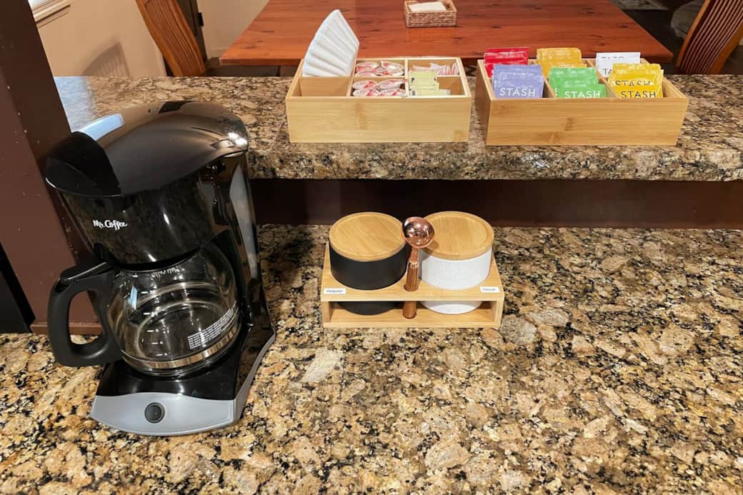 Coffee and tea are readily available for your convenience. Some regular and decaf grounds are available for you with a simple drip coffee maker, along with sugar, sweetener, and creamers. It also offers a variety of different teas.
