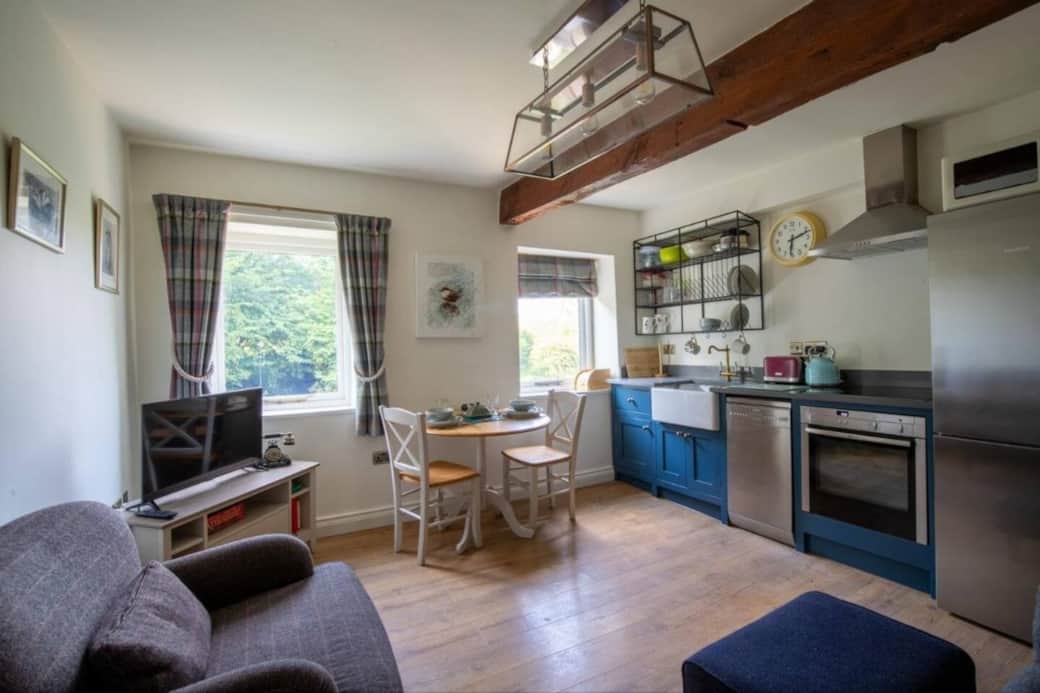 Bright open-plan living space with fully equipped kitchen