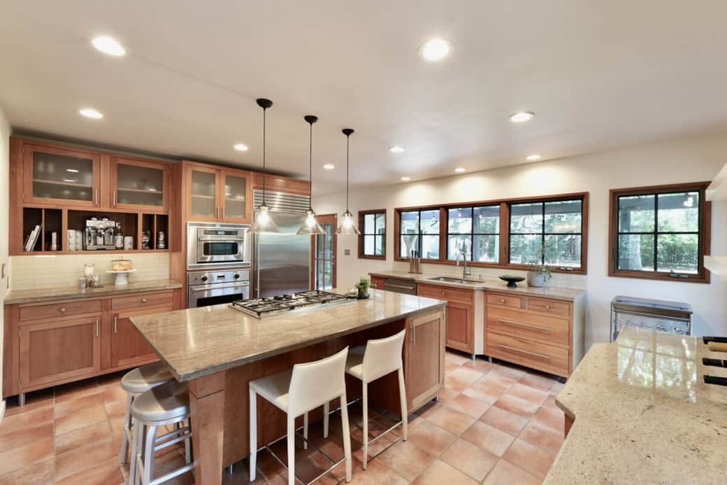 Our standout, fully equipped chef’s kitchen. Anchored by a massive island and high-end commercial appliances, it’s an inviting space where friends can sit and enjoy a cocktail while dinner is sizzling away.
