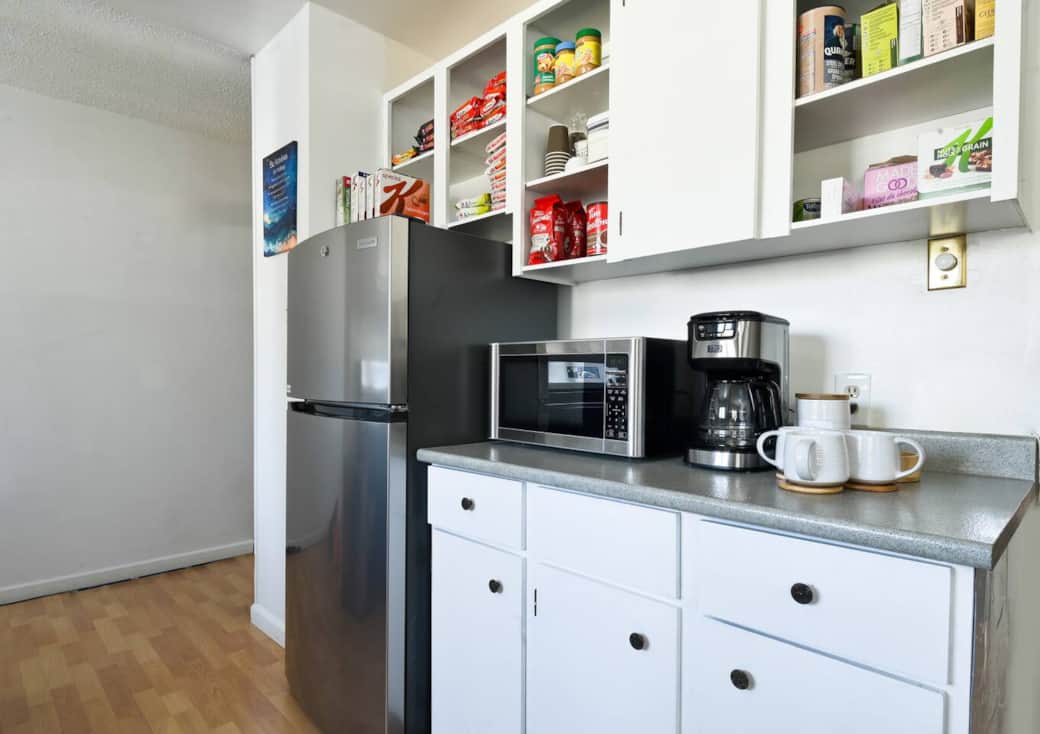 Cook your favorite meals in this fully equipped kitchen, featuring modern appliances and all the ess