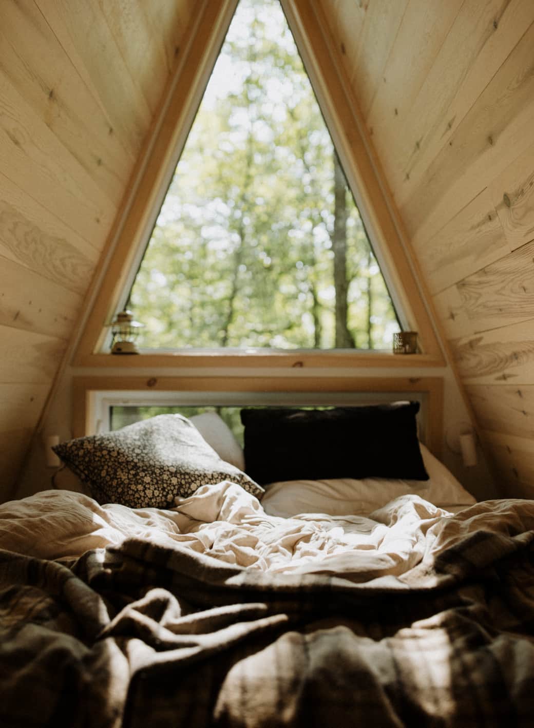 Wake up to the forest—the iconic triangle window. Photo credit: @roblloyd_ Wake up to the forest—the iconic triangle window. Photo credit: @roblloyd_