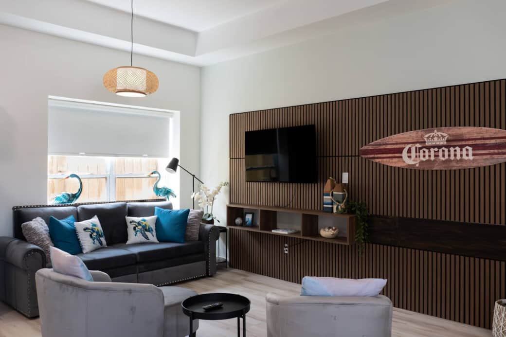 Spacious living room with large TV and SOFA that opens up into a King Sized Bed 