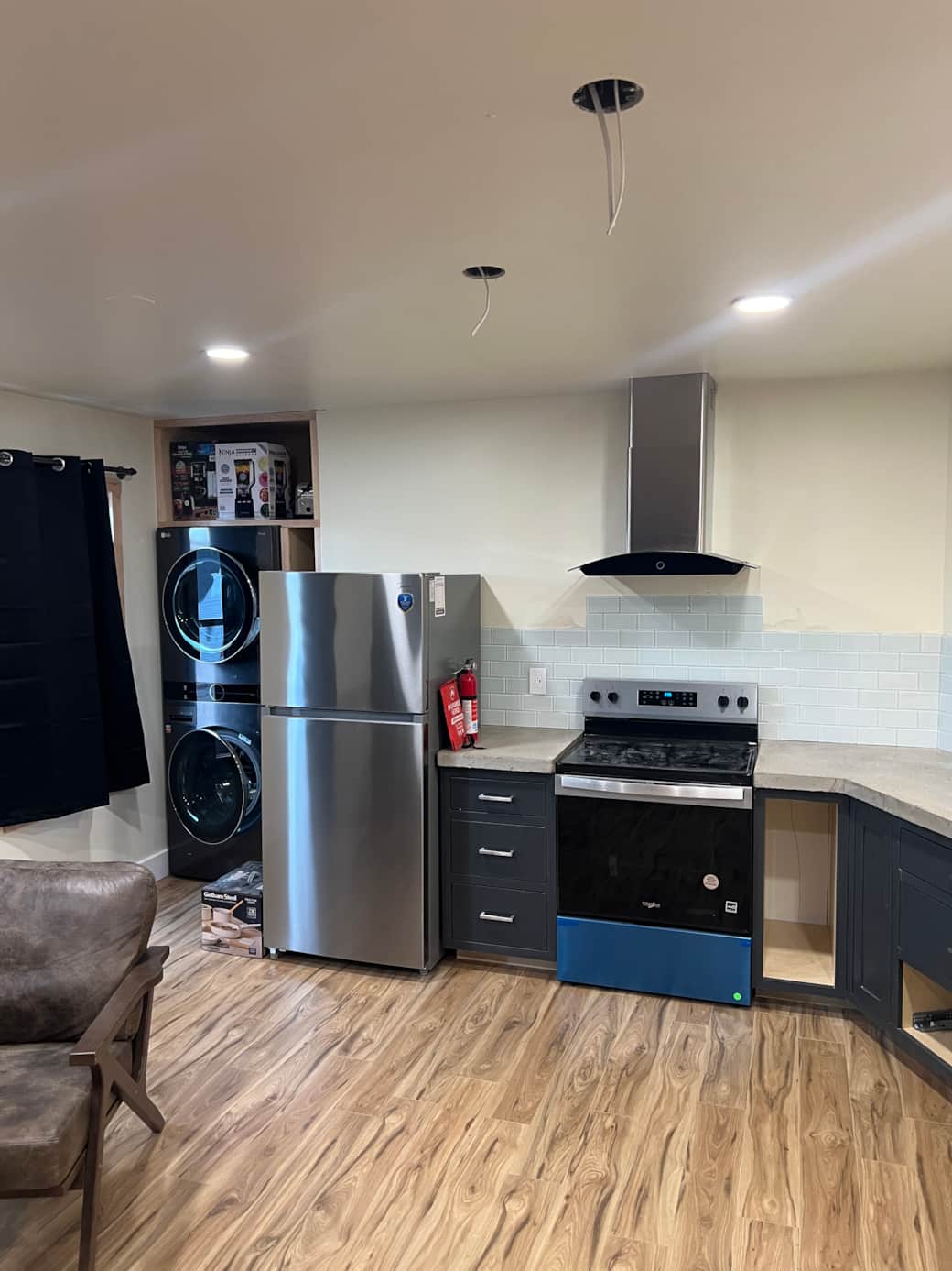 In unit, washer and dryer, full size fridge and cook top.