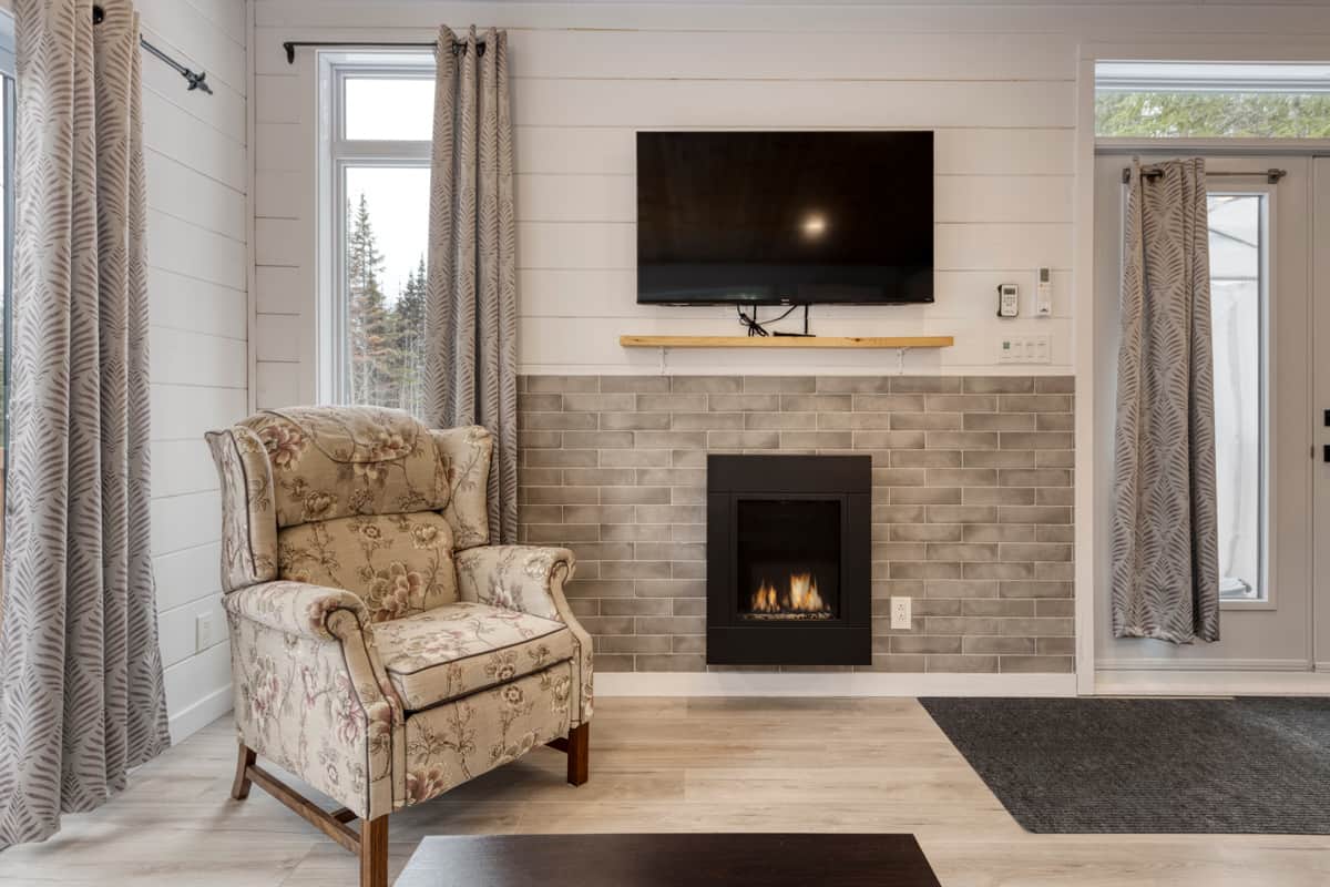 Living room with fireplace and TV