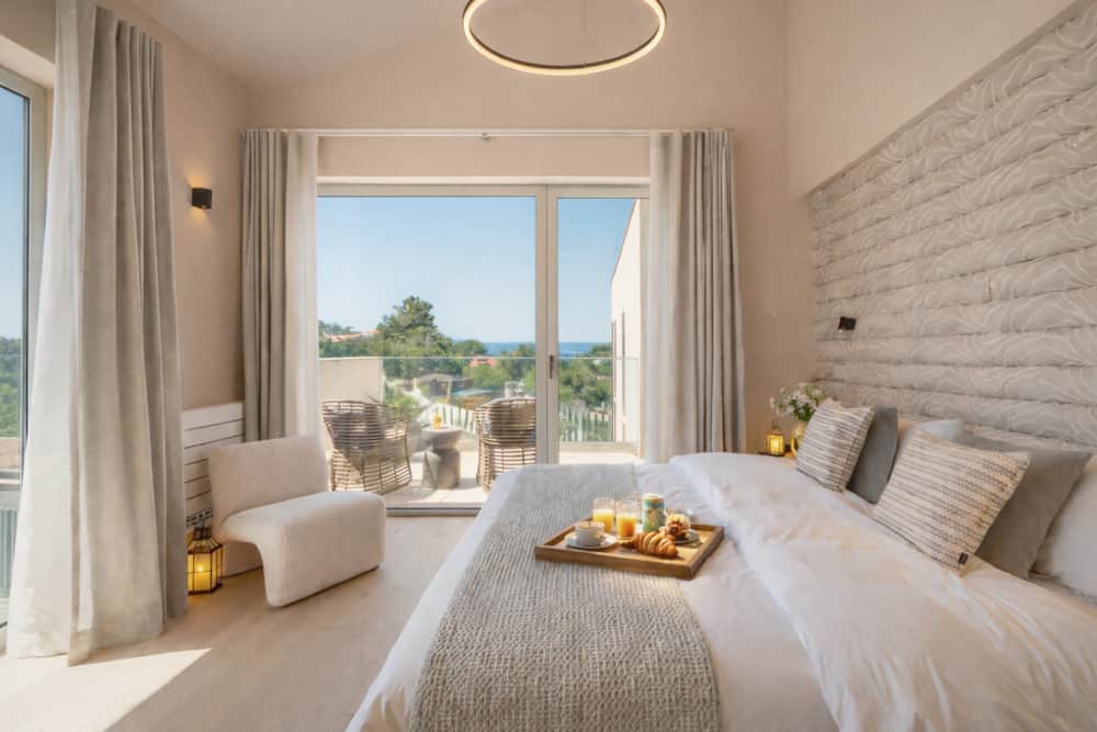 Bright bedroom of Villa Medusa Paraiso with breakfast tray