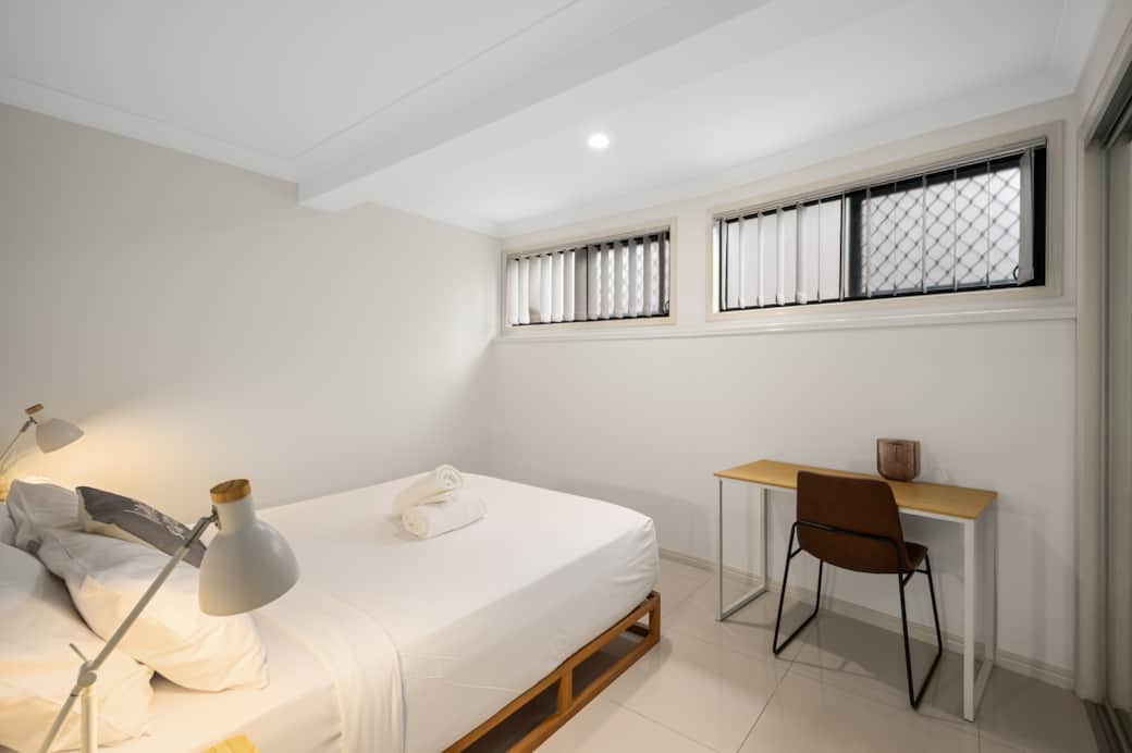 Bedroom 1: Peaceful bedroom with cozy design and ample storage