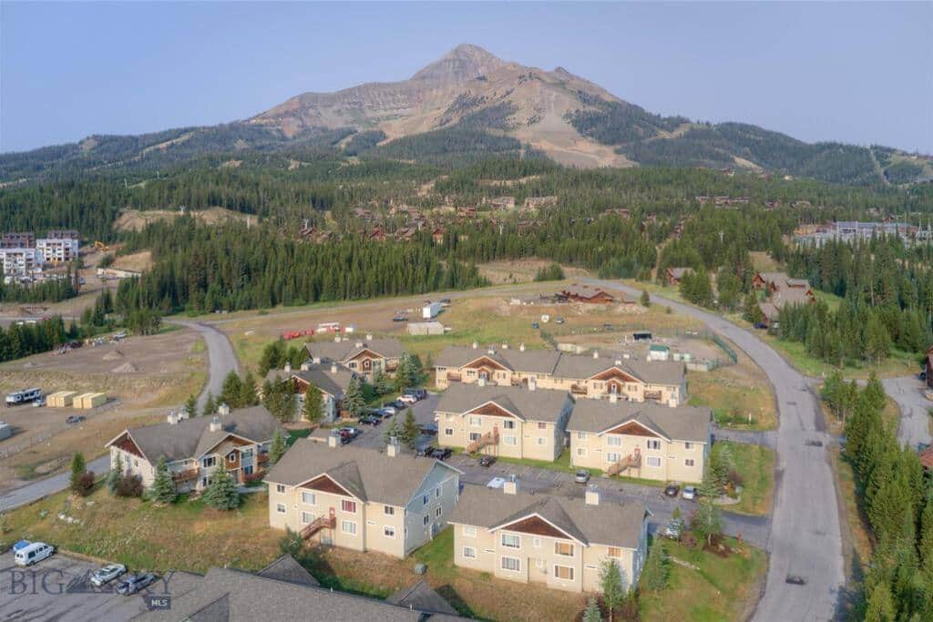 Cedar Creek Condos with Big Sky Resort in the background