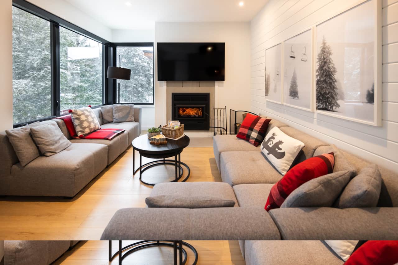 View of the living room with wood burning fire place