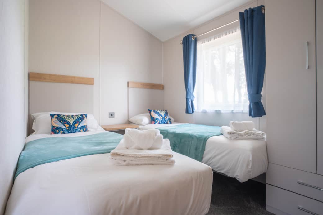Another bright twin bedroom giving everyone space to relax and unwind