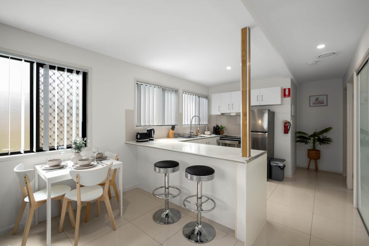 Kitchen: Sleek kitchen with ample storage, modern appliances 