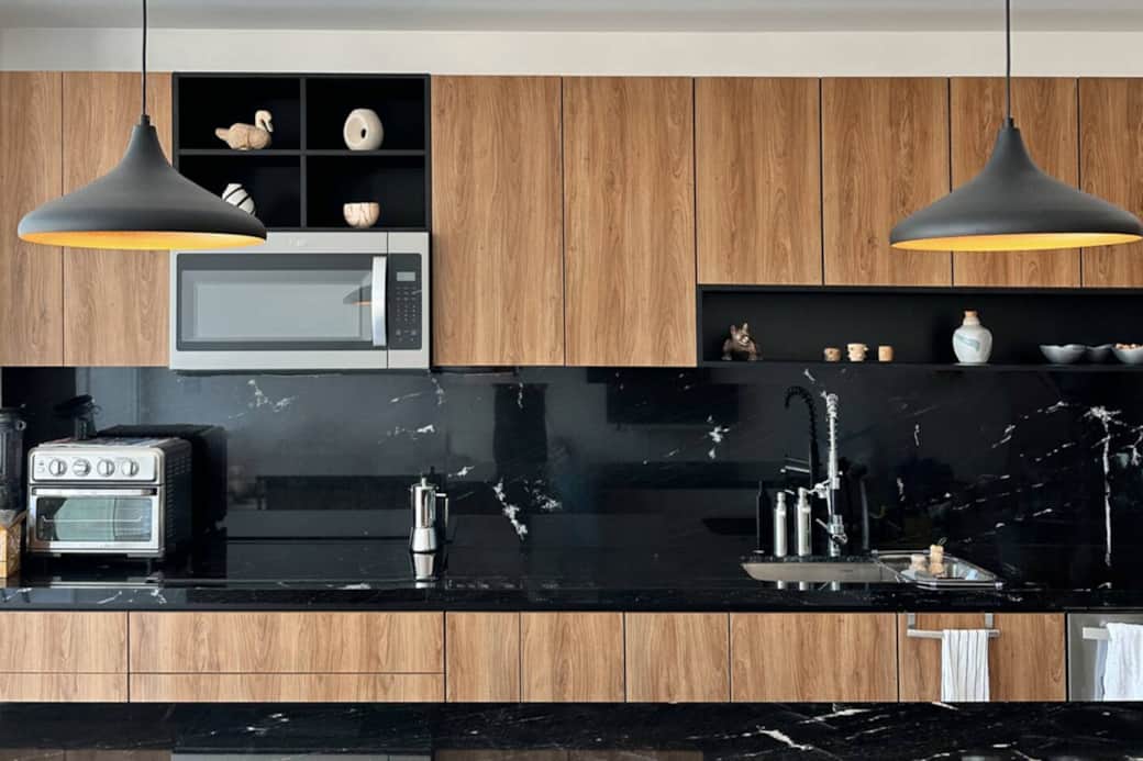 Fully equipped kitchen with filtered water, induction cooktop, air fryer/toaster, microwave, high-performance blender, food chopper, granite non-stick pots and pans, and a large sink, accented with local artisan decor. Fully equipped kitchen with filtered water, induction cooktop, air fryer/toaster, microwave, high-performance blender, food chopper, granite non-stick pots and pans, and a large sink, accented with local artisan decor.