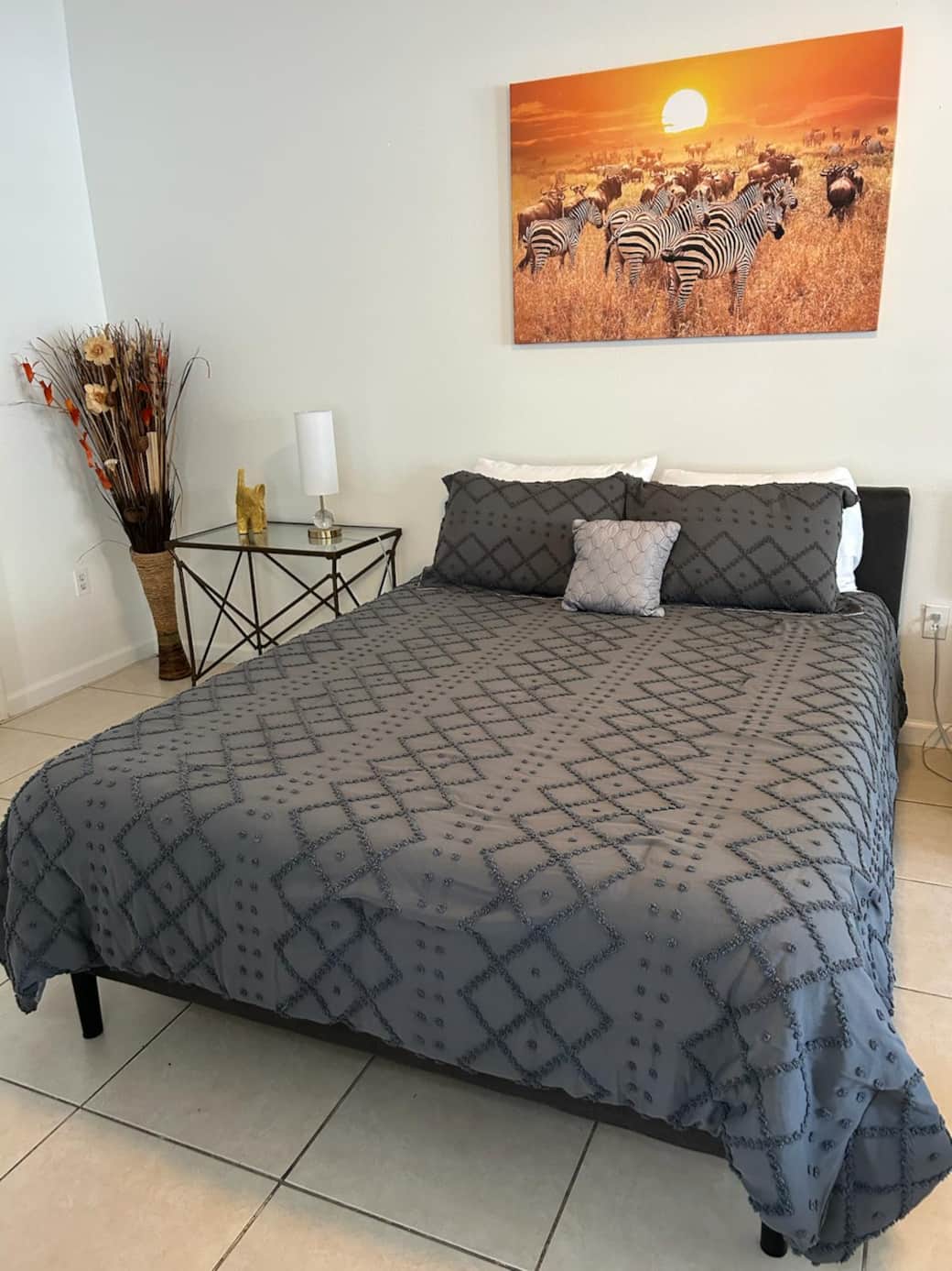 Beautiful queen bed with premium linens, cozy pillows, and elegant decor. Lakeland, FL