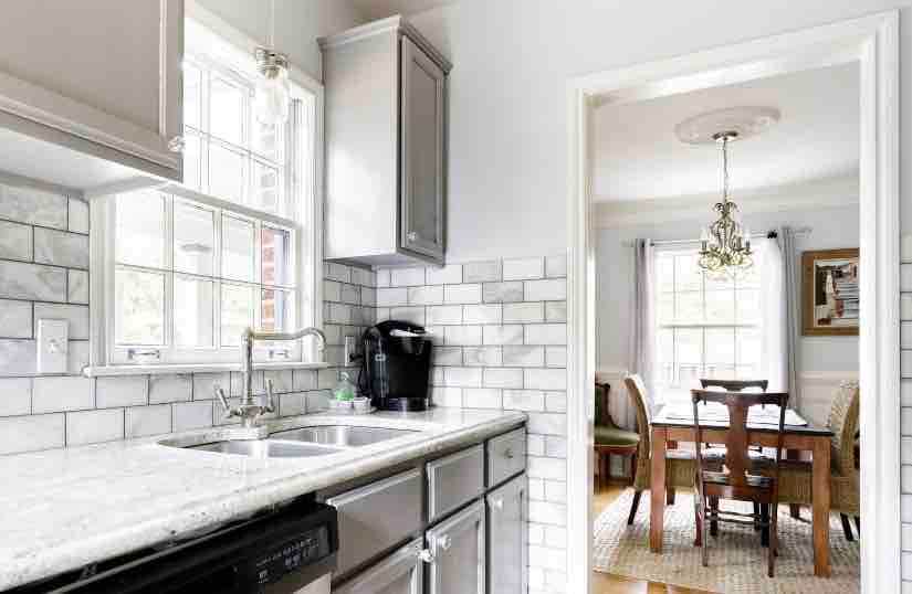 Beautiful marble kitchen looking out to the dining room.