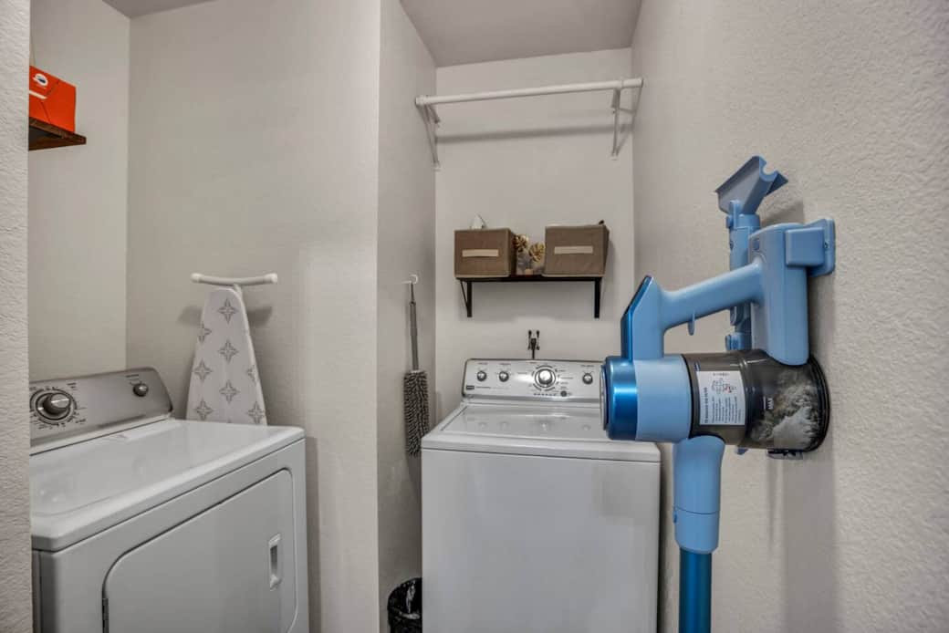 The laundry room is stocked with a full-sized washer and dryer, laundry detergent pods, dryer sheets, iron/ironing board, clothes steamer, and a hand-held cordless vacuum. The laundry room is stocked with a full-sized washer and dryer, laundry detergent pods, dryer sheets, iron/ironing board, clothes steamer, and a hand-held cordless vacuum.