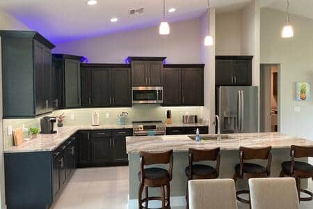 Fully stocked kitchen, appliances include fridge, range, microwave, and dishwasher. Soaps provided. 