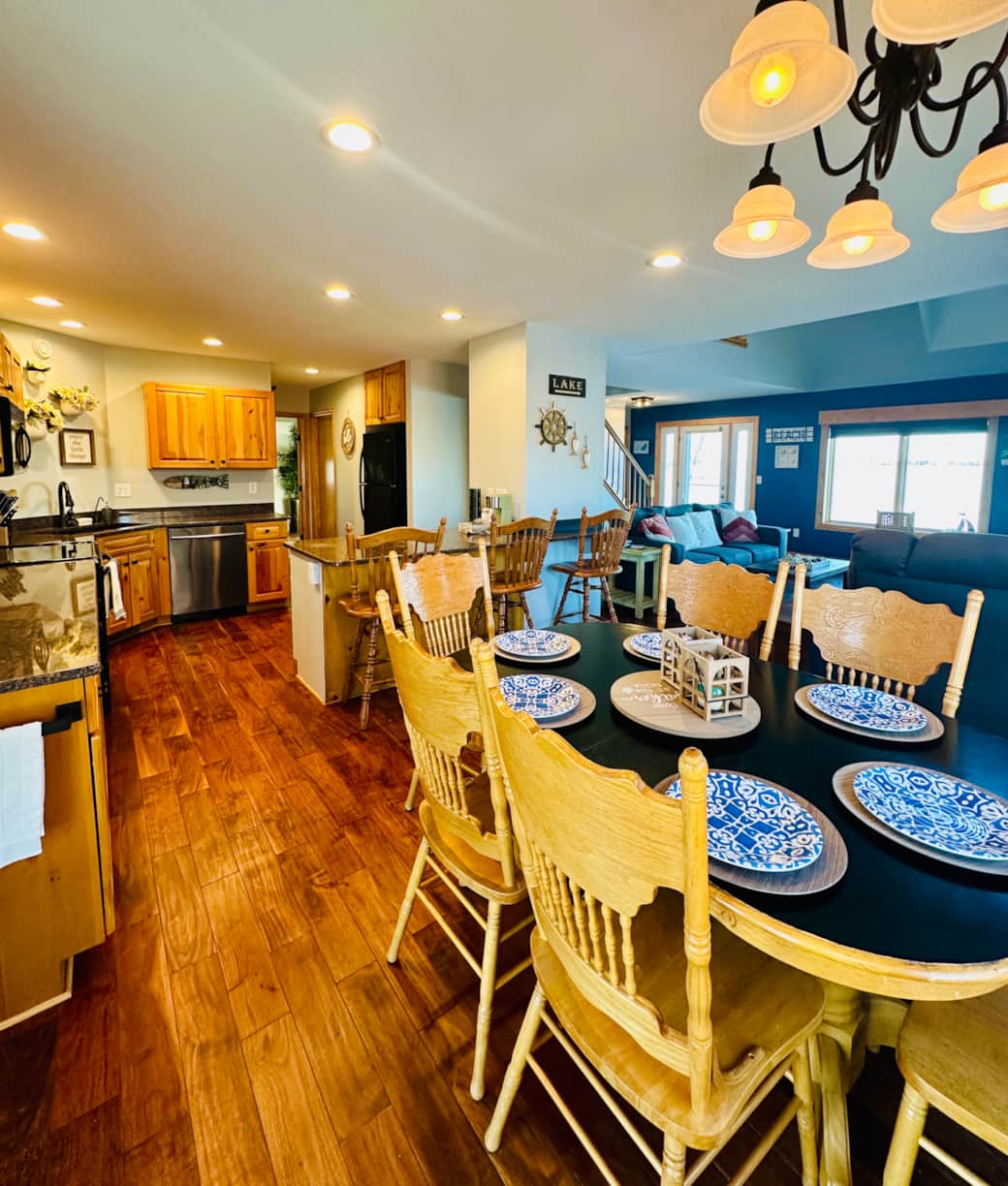 Gather around the spacious dining table for meals, games, and conversation—plenty of room for the whole crew to connect and unwind. Gather around the spacious dining table for meals, games, and conversation—plenty of room for the whole crew to connect and unwind.