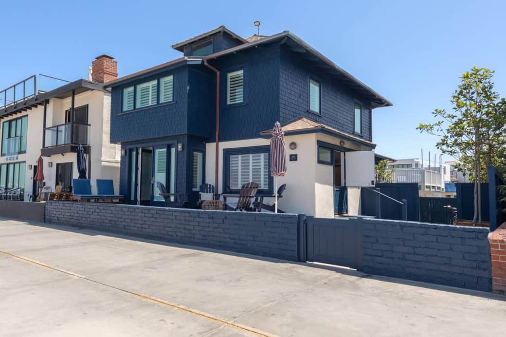 The Strand Stuga compound includes a 2-story home & a 2-story casita & private side yard & parking.