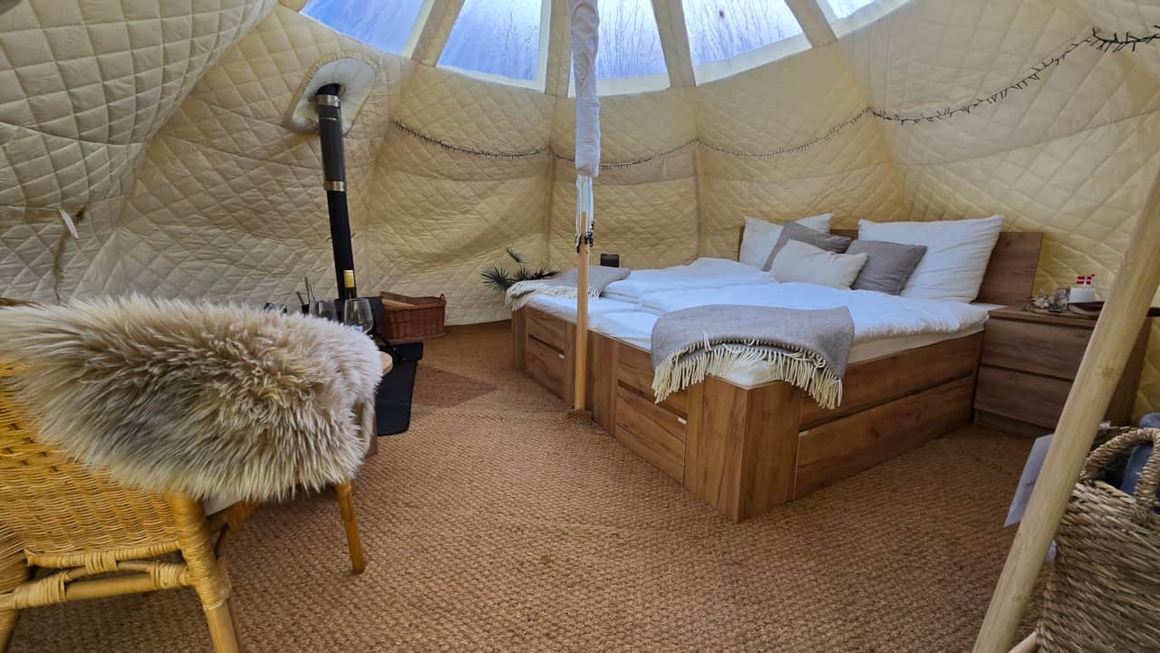 Cosy glamping tent for two with wood stove, sheepskins and soft wool blankets