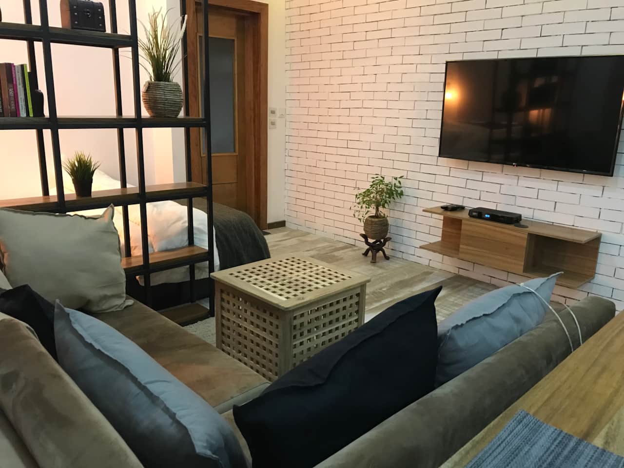 2-seater corner sofa with 55-inch smart tv