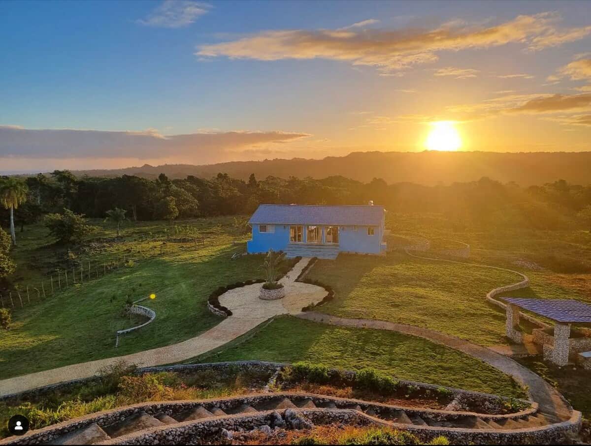 The Blue House and estate gardens at sunset