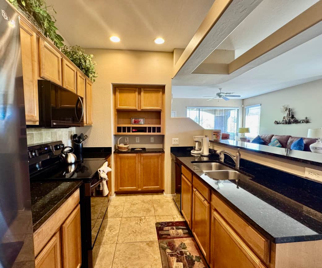Black granite with backsplash and dual sink