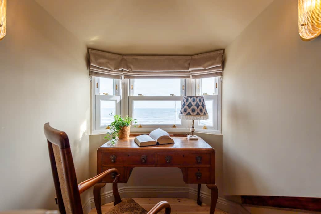 Work or write in peace at a stylish desk with inspiring panoramic sea views.