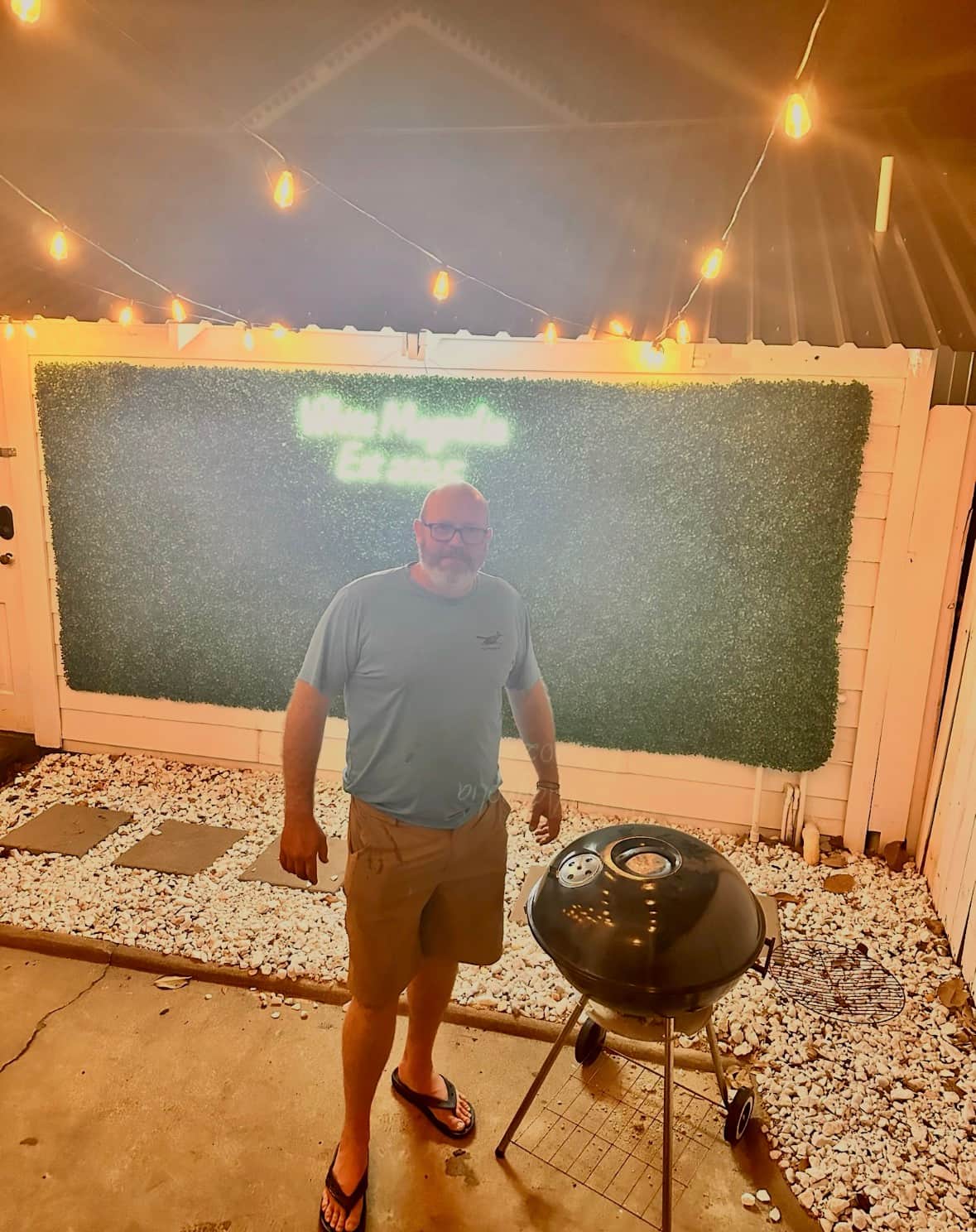 Guest grilling in the courtyard at White Magnolia Galveston