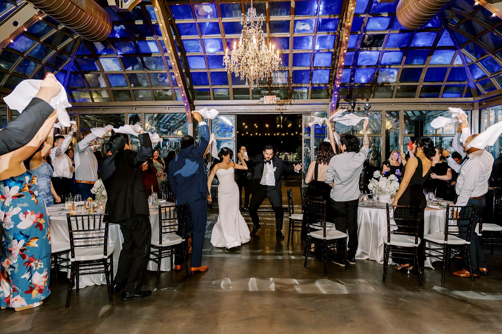 Bride and groom dancing with friends during a wedding reception celebration at The Bryan Museum in Galveston