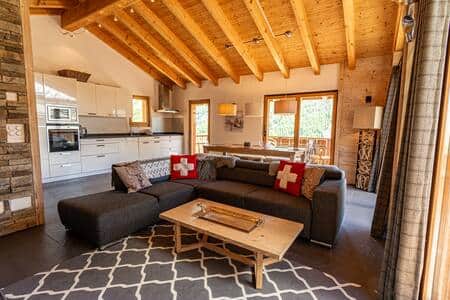 Lounge area with large Tv and cozy Fireplace