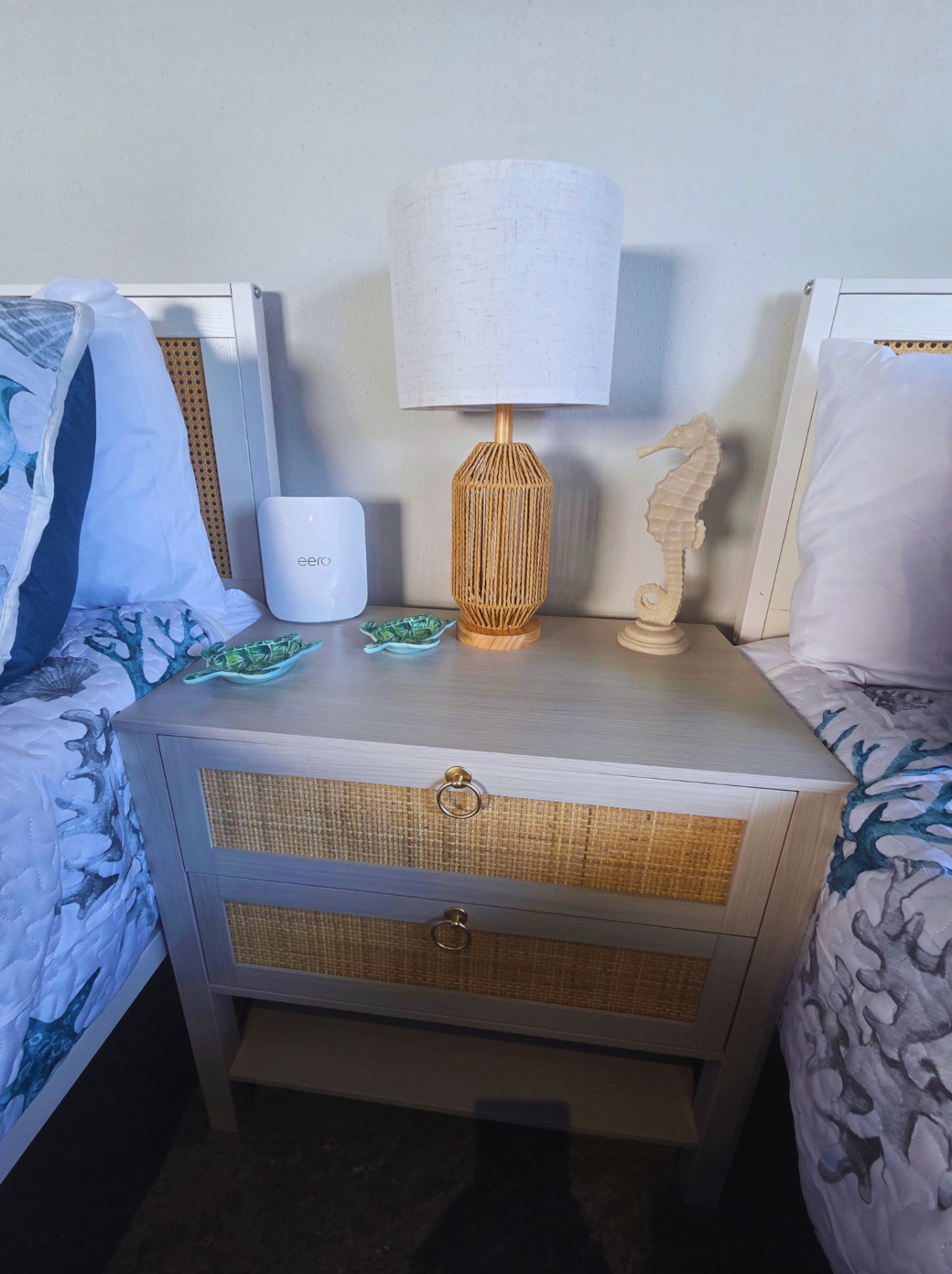 Coastal decor with sea turtles, a seahorse, and a charming bedside lamp. Treasure Island, FL