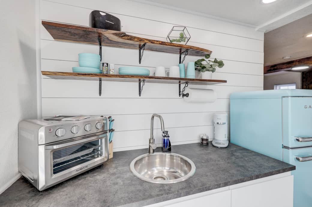 This kitchenette comes with air fryer, toaster and coffee maker. Dishes and some cookware provided. This kitchenette comes with air fryer, toaster and coffee maker. Dishes and some cookware provided.