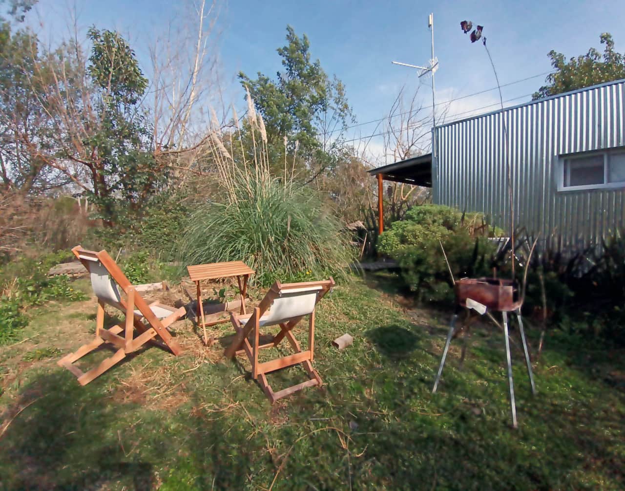Jardín privado con parrilla móvil.