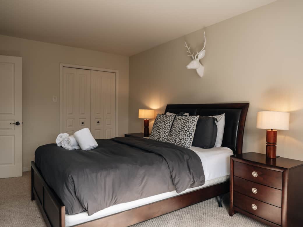 The master features a queen bed and ensuite bath