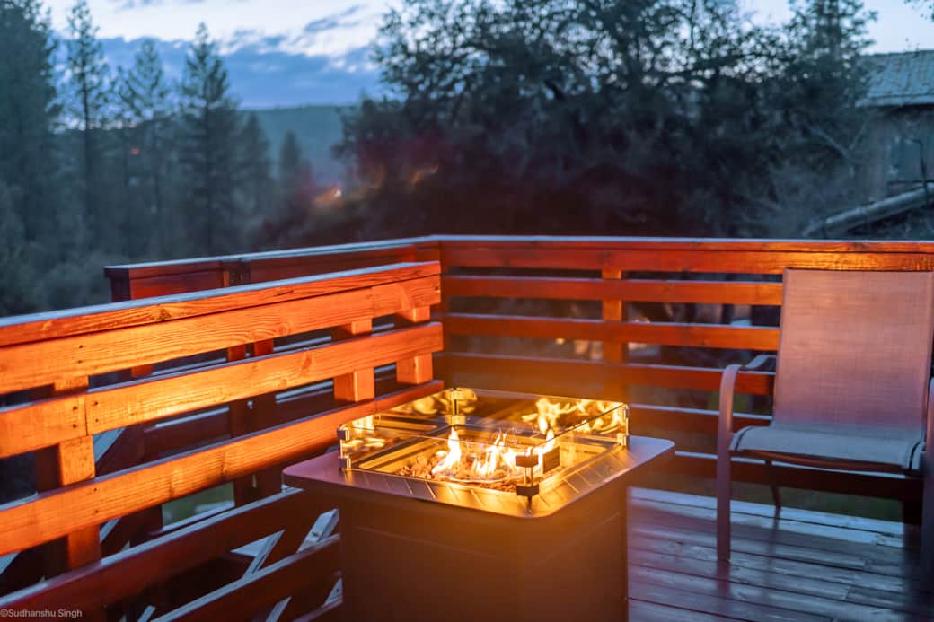 Enjoy Sunset, Drink and S'more by this fireplace table