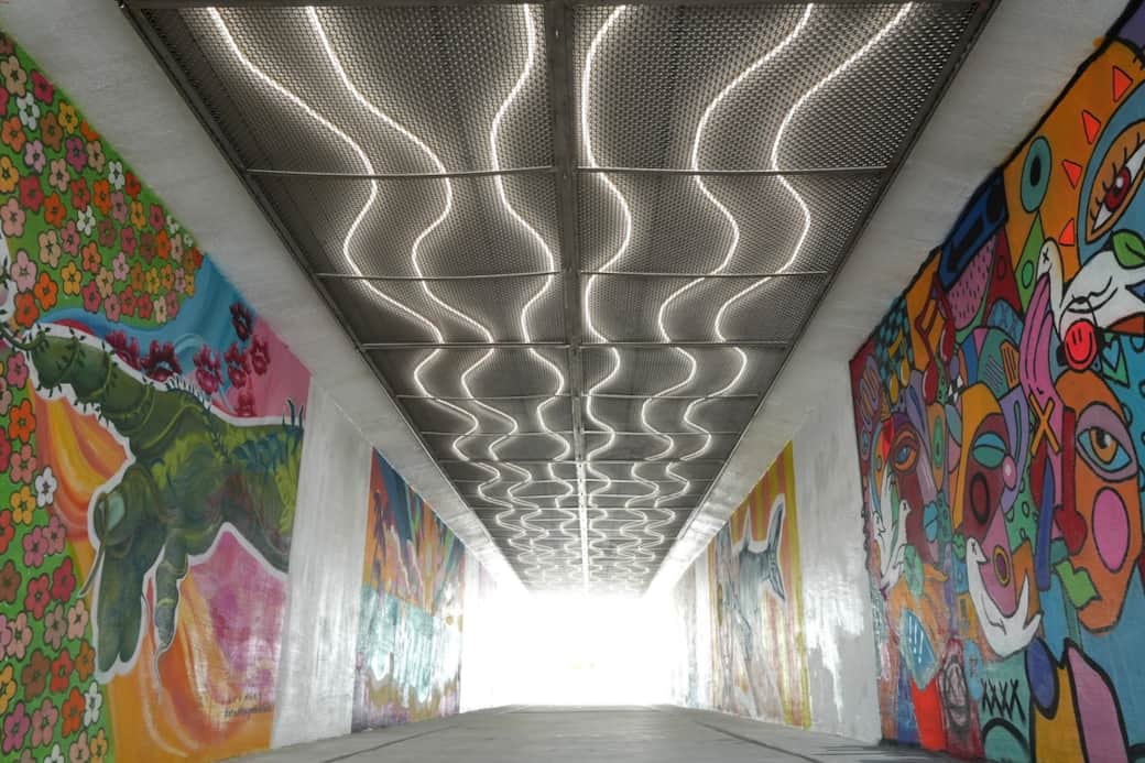 Take the new underground tunnel from 30Avenue to Rosemary Beach for its charming architecture and Alys Beach for its striking white buildings and serene.