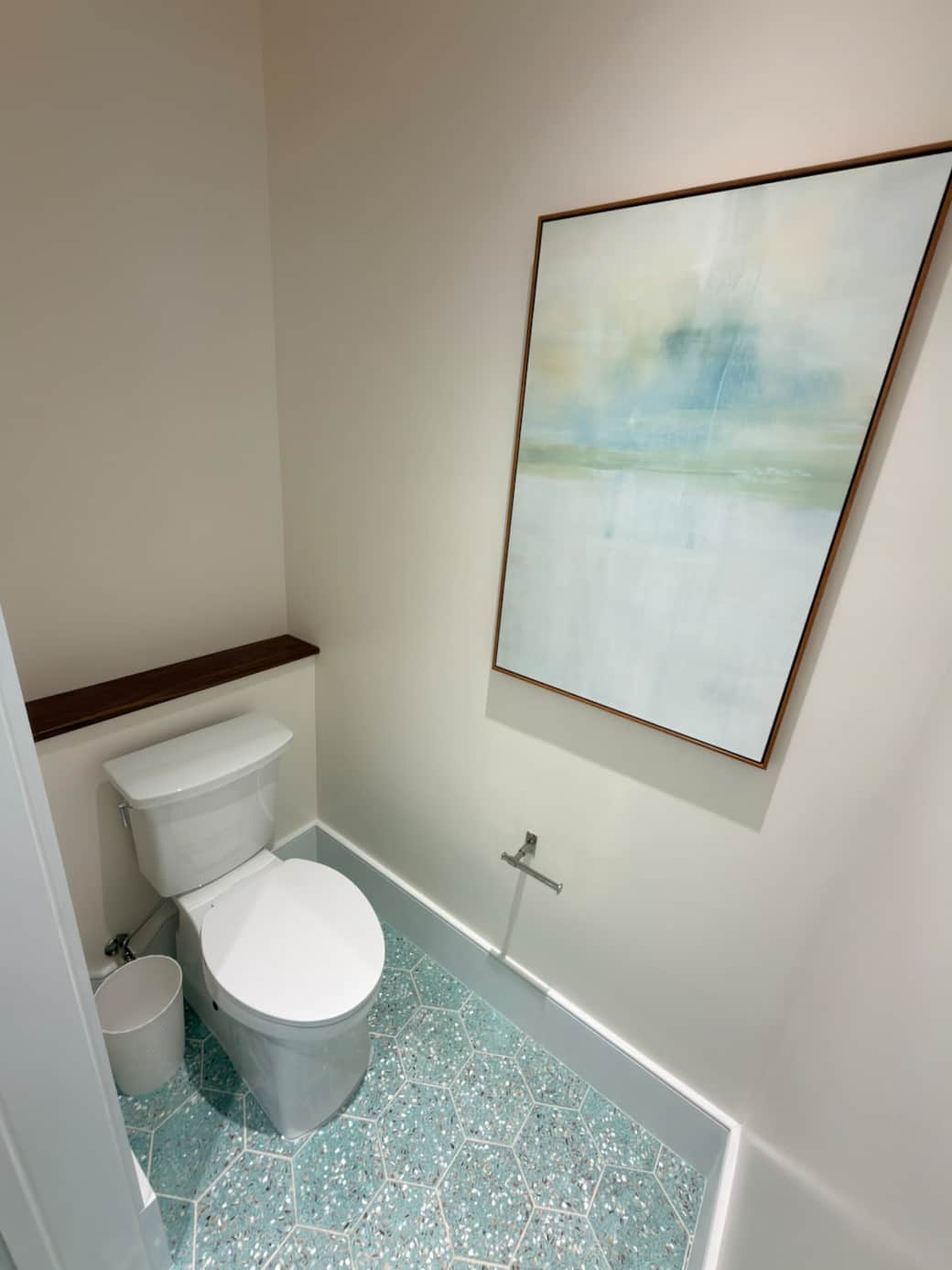 A spacious, spa-like en-suite bath featuring a walk-in shower, soaking tub, and his and hers vanity. Finished in a refined coastal-modern style, it offers a bright, luxurious setting designed for comfort, relaxation, and privacy.