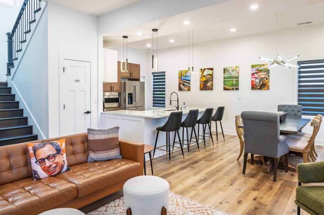 Open concept main floor with plenty of windows with roller shades allowing you to customize the amount of light vs. privacy. Enjoy one-of-a-kind photography throughout the home, created by the host. Dining room table seats 8 comfortably.