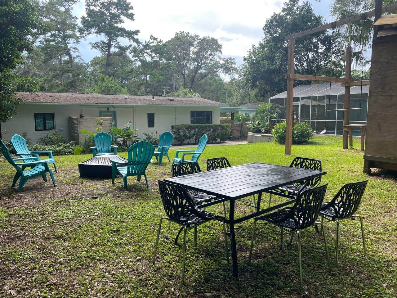 Metal table with 6 chairs for dining and gathering al fresco.