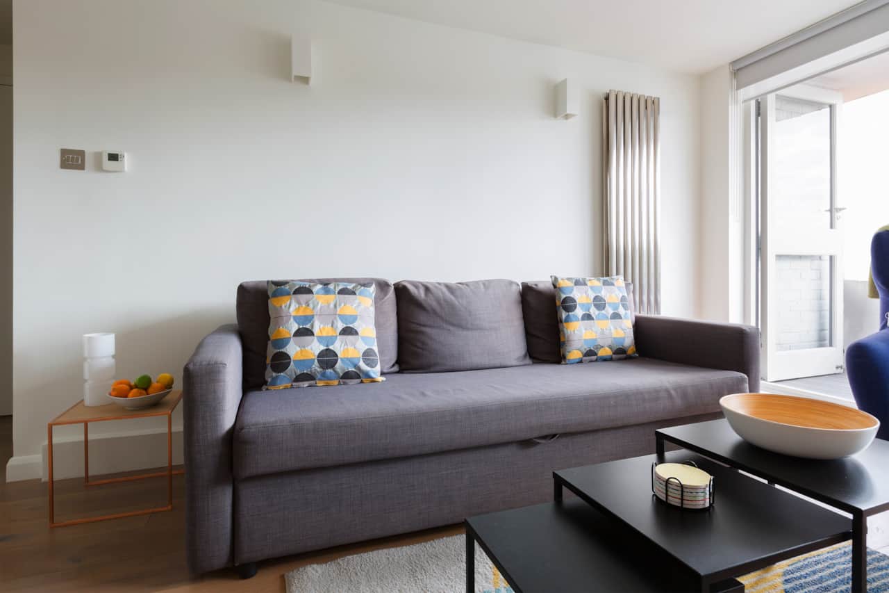 Comfortable sofa with balcony access, Tower Bridge flat