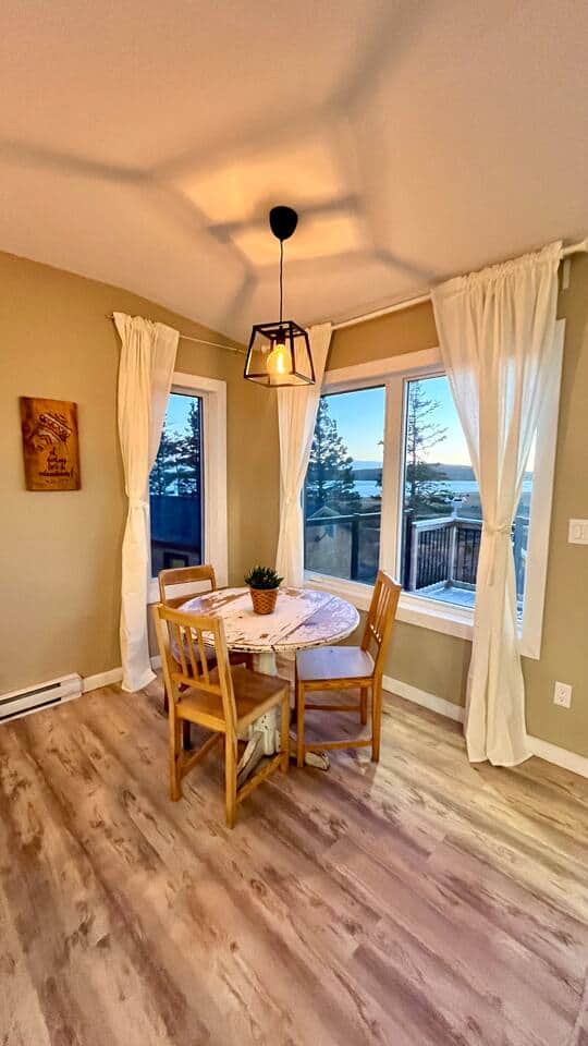 Bright dining nook with water views and deck access—perfect for coffee. Bright dining nook with water views and deck access—perfect for coffee.